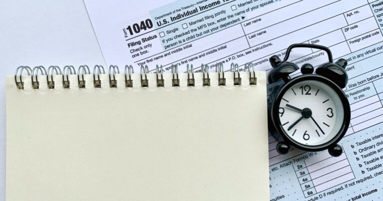 Statutory compliance for SMEs shown by a notepad on a tax form